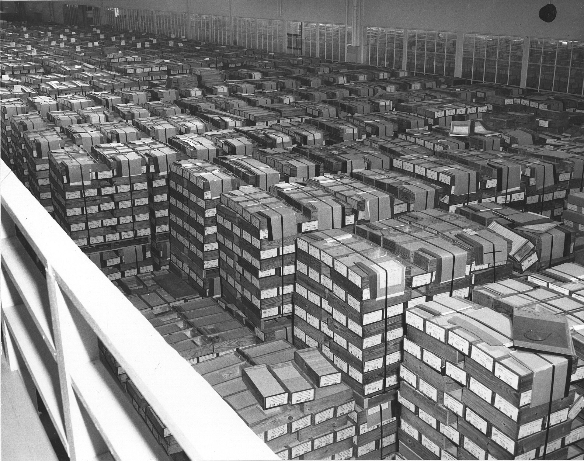 Stacks of boxed IBM record cards filling a federal records warehouse, 1959
